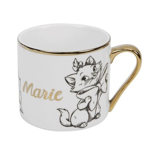 A white mug with "Marie" written on it.