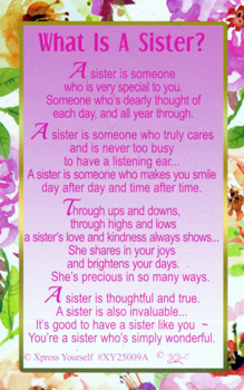 A poem that says "What is a sister?" on it.