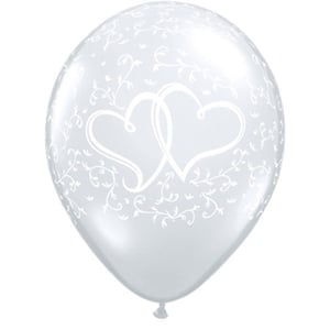 A white balloon with two hearts on it. (No grammatical errors)