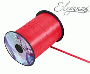 A spool of red Elegantza poly ribbon on a white background.