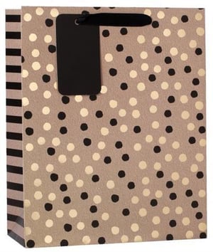 A brown gift bag with black and gold polka dots and a black tag.