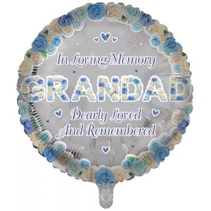 A balloon that says "In loving memory. Grandad deeply loved and remembered."