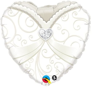 A heart-shaped balloon with swirls and a diamond in the center.
