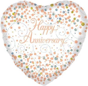 A heart-shaped balloon with the words "Happy Anniversary" written on it.
