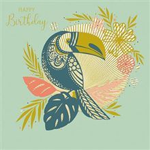 A happy birthday card with a toucan surrounded by tropical leaves and flowers.