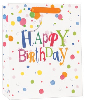 A happy birthday gift bag with colorful polka dots.