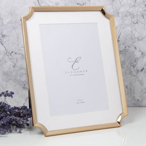 A picture frame with the word "elegance" on it.