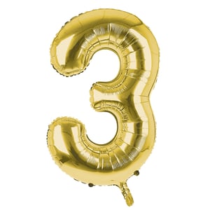 A gold balloon is in the shape of the number three.