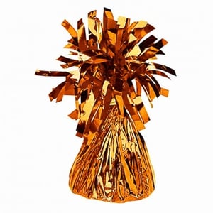 A gold foil balloon weight with tinsel is on a white background.