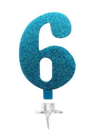 A blue glitter birthday candle in the shape of the number six on a white background.