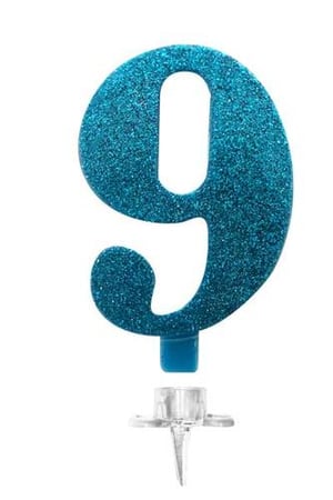 A blue glitter number 9 cake topper on a white background.