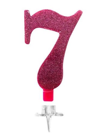 A pink birthday candle in the shape of the number seven on a white background.