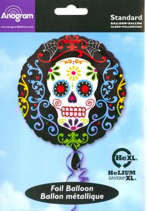 A foil balloon with a sugar skull on it.