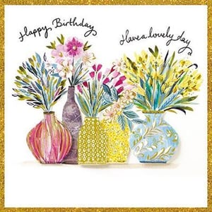 A birthday card with three vases filled with flowers and the words "Happy birthday, have a lovely day."