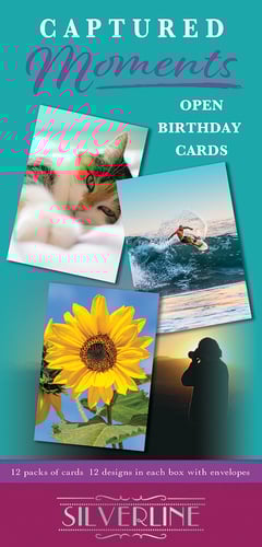 A box of captured moments opens birthday cards.