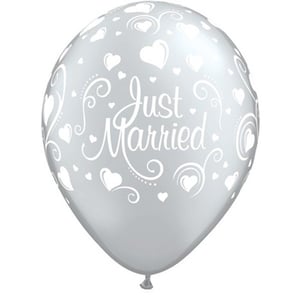 A just married balloon with hearts and swirls on it.