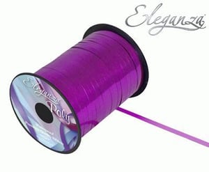 A roll of purple ribbon on a white background.