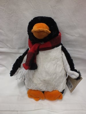 A stuffed penguin with a tag that says 'penguin' on it.