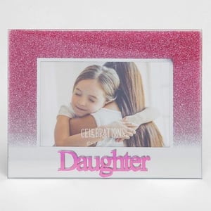 A picture frame with the word "daughter" on it.