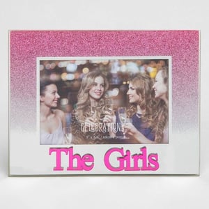 A picture frame with the words "the girls" on it.