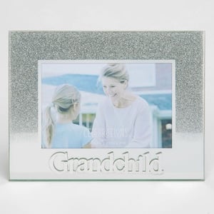 A picture frame with a picture of a woman and a little girl in it.