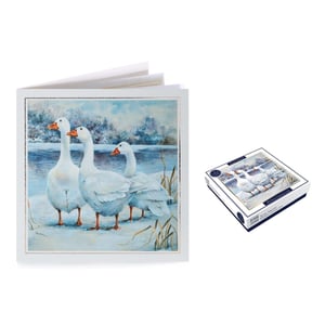 A painting of three ducks is next to a box of ducks.