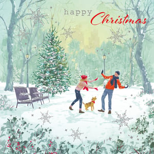 A Christmas card with a man and woman playing in the snow.