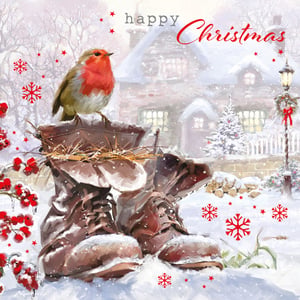 A Christmas card has a bird sitting on a pair of boots.