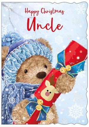 A teddy bear is holding a Christmas cracker with a reindeer on it.