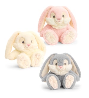 Three stuffed bunny rabbits are sitting next to each other.