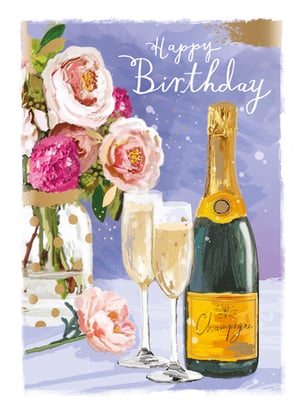A birthday card with a bottle of champagne and two glasses.