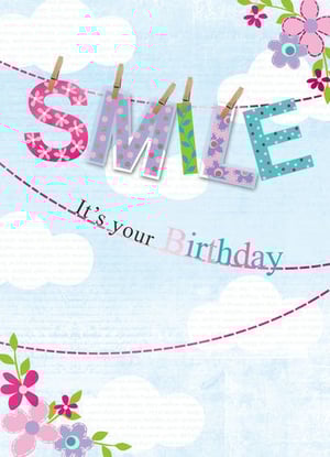 A birthday card that says, "Smile, it's your birthday."