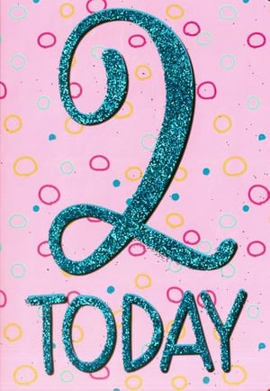 A pink birthday card with the number 2 on it.