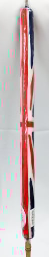 A red, white, and blue candle with a British flag design.