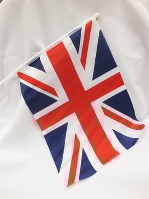 a small british flag on a white cloth