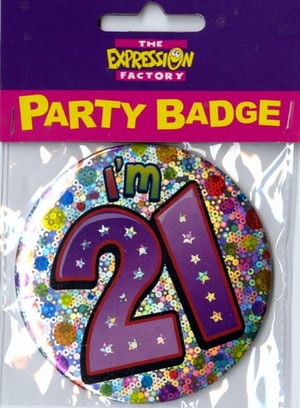 A party badge that says "I'm 21" on it.