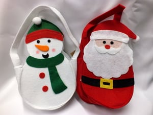 A Santa and a snowman are sitting next to each other.