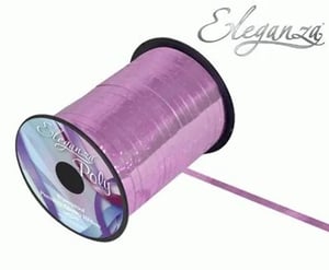 A roll of purple ribbon on a white background.