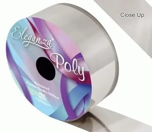 A close-up of a roll of ribbon on a white background.