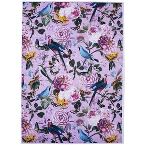 A purple rug with flowers and birds on it.