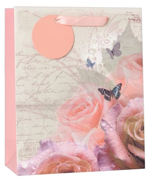 A pink gift bag with roses and butterflies on it.