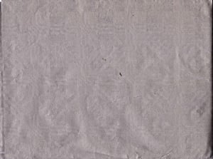 A close-up of a piece of gray paper.