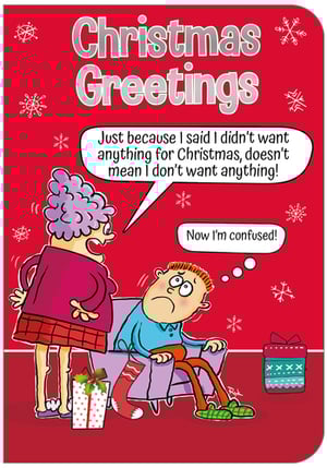 A cartoon of a woman standing next to a man on a couch with the words "Christmas greetings" at the top.
