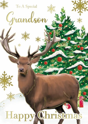 A Christmas card with a deer in front of a Christmas tree.