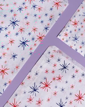three pieces of fabric with red white and blue stars on them