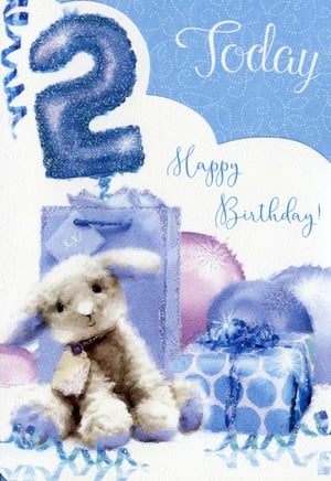 A birthday card for a boy with a stuffed bunny and balloons.