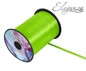 A roll of neon green ribbon is sitting on a white surface.