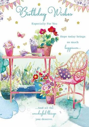 A birthday card with flowers and a chair on it is needed.