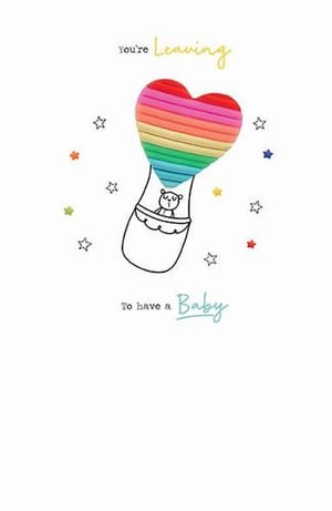 A baby is flying in a hot air balloon in the shape of a heart.