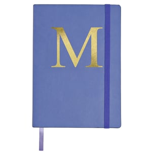 A blue book with a gold letter M on it.